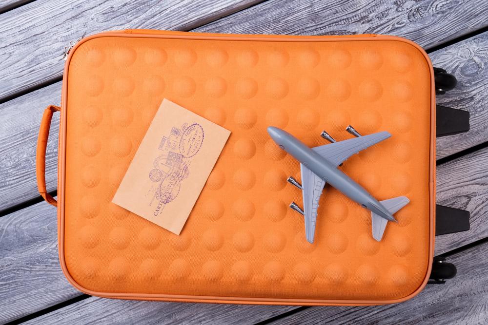 Top,View,Travel,Stuff,On,Wood.,Orange,Suitcase,,Post,Mail